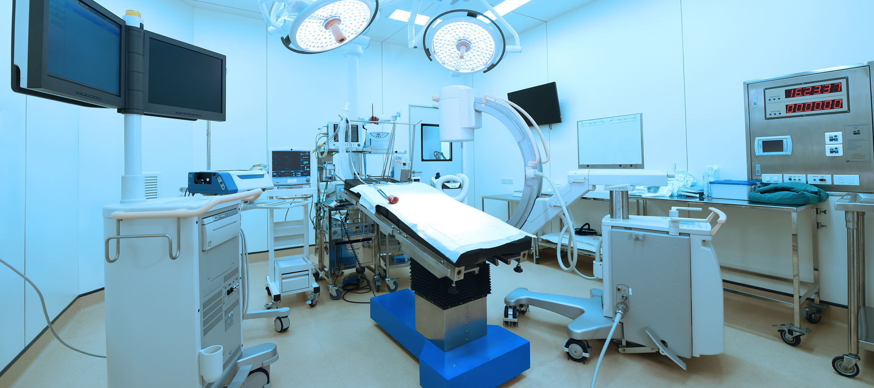 Doctor Standing in Front of Medical Equipment