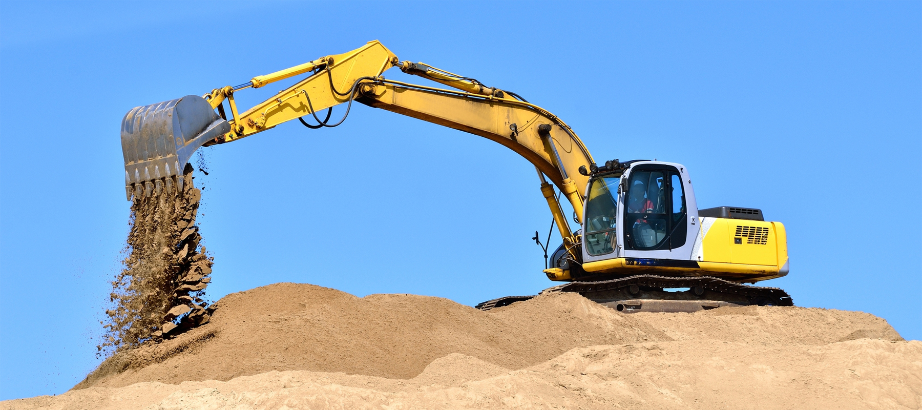 New Excavator Digging in Sand Dunes