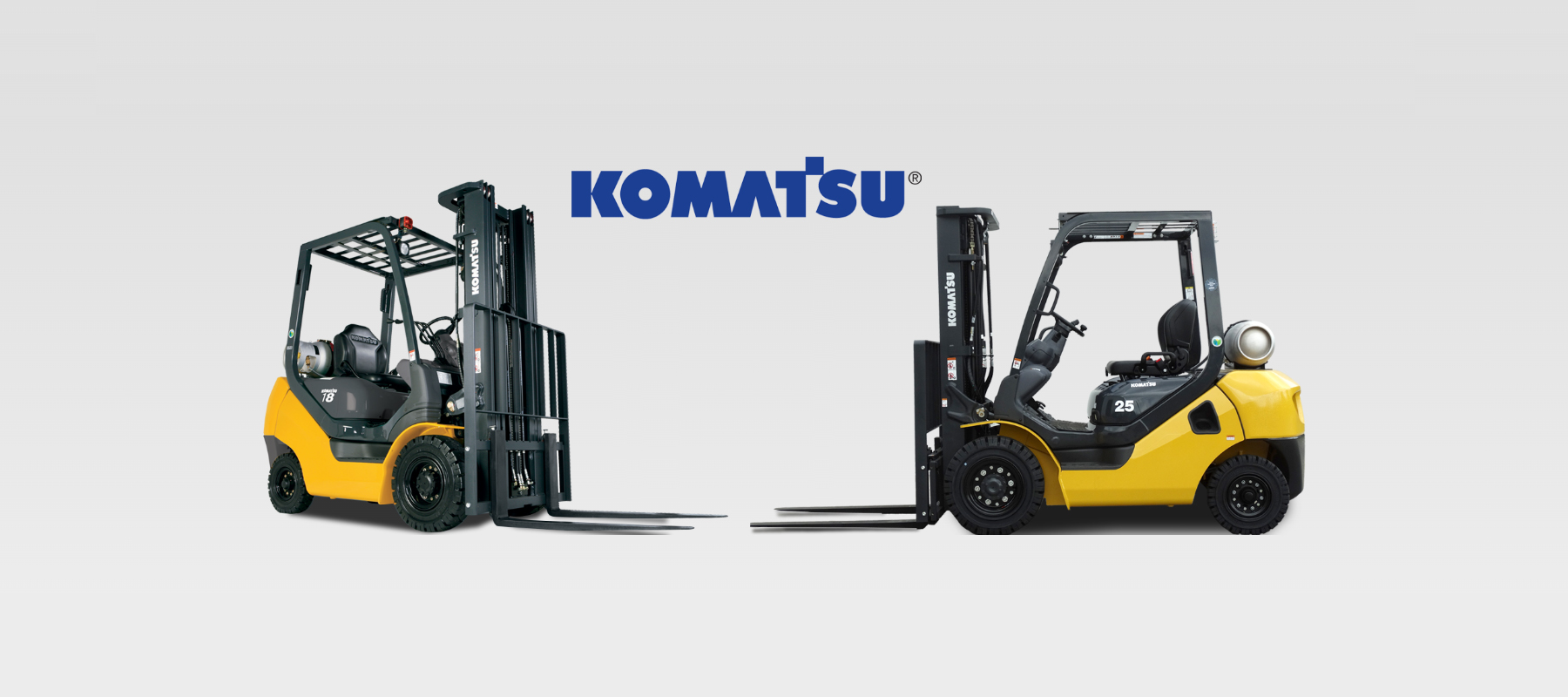Multiple Komatsu Forklifts on White Background