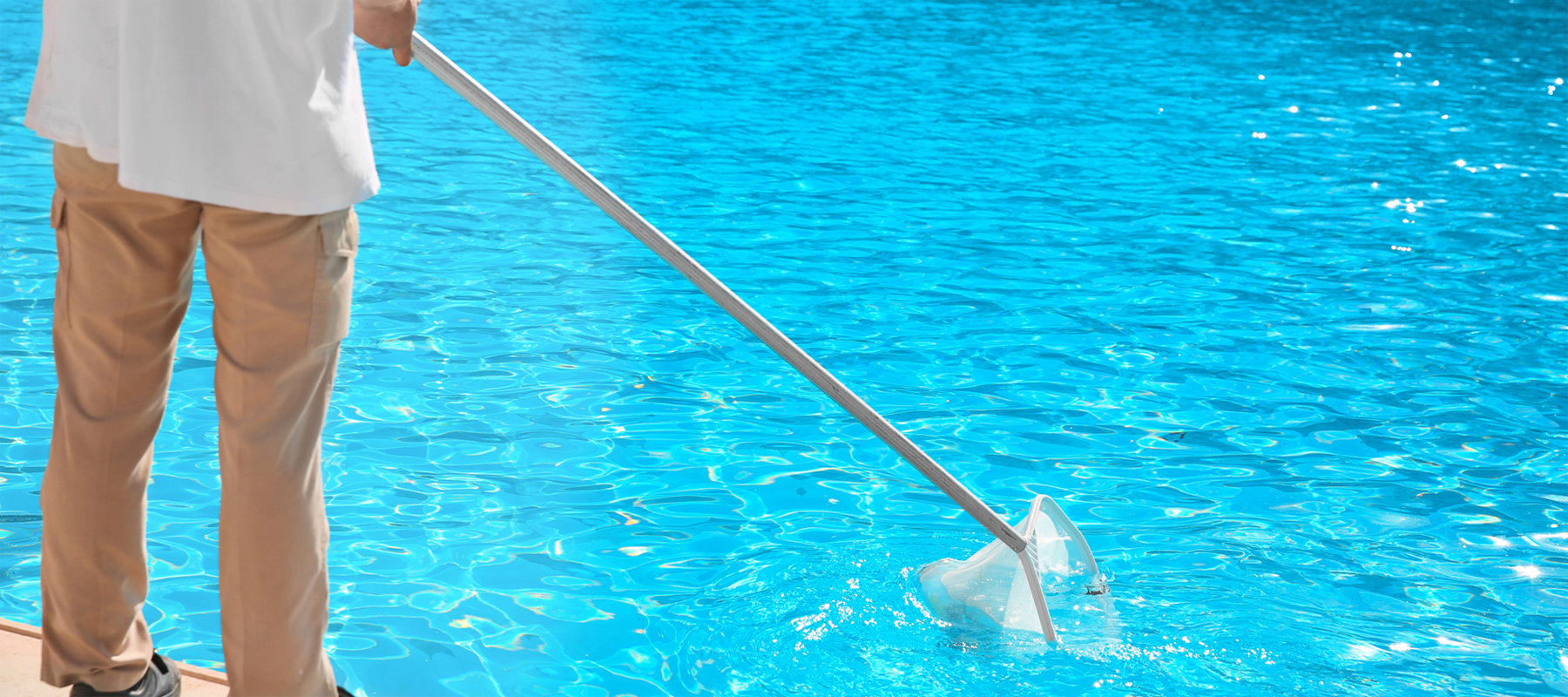 Man Cleaning a Pool