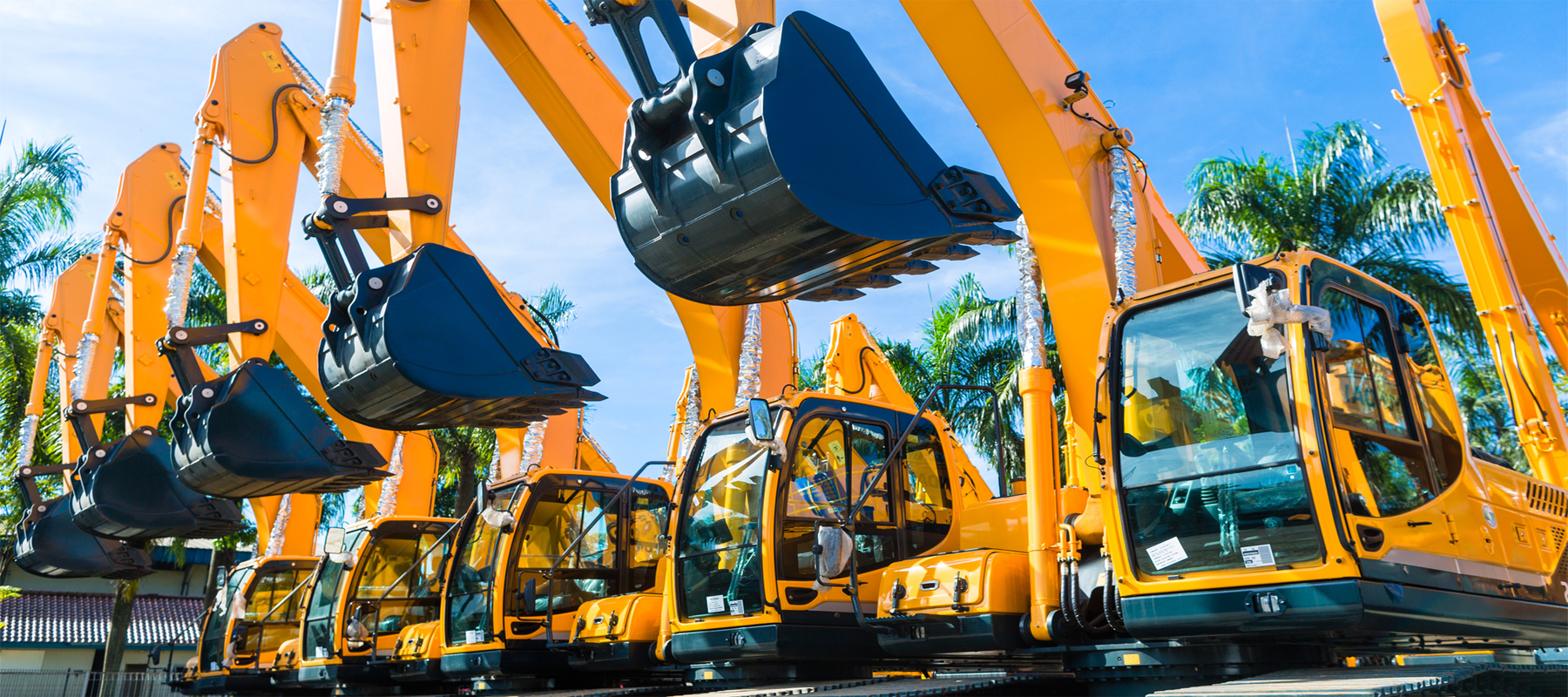 Row of Mini Excavators Ready to Rent or Lease