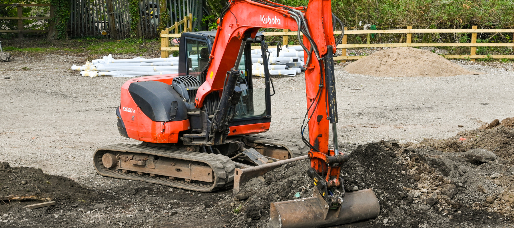 Used Excavator Working in the Dirt