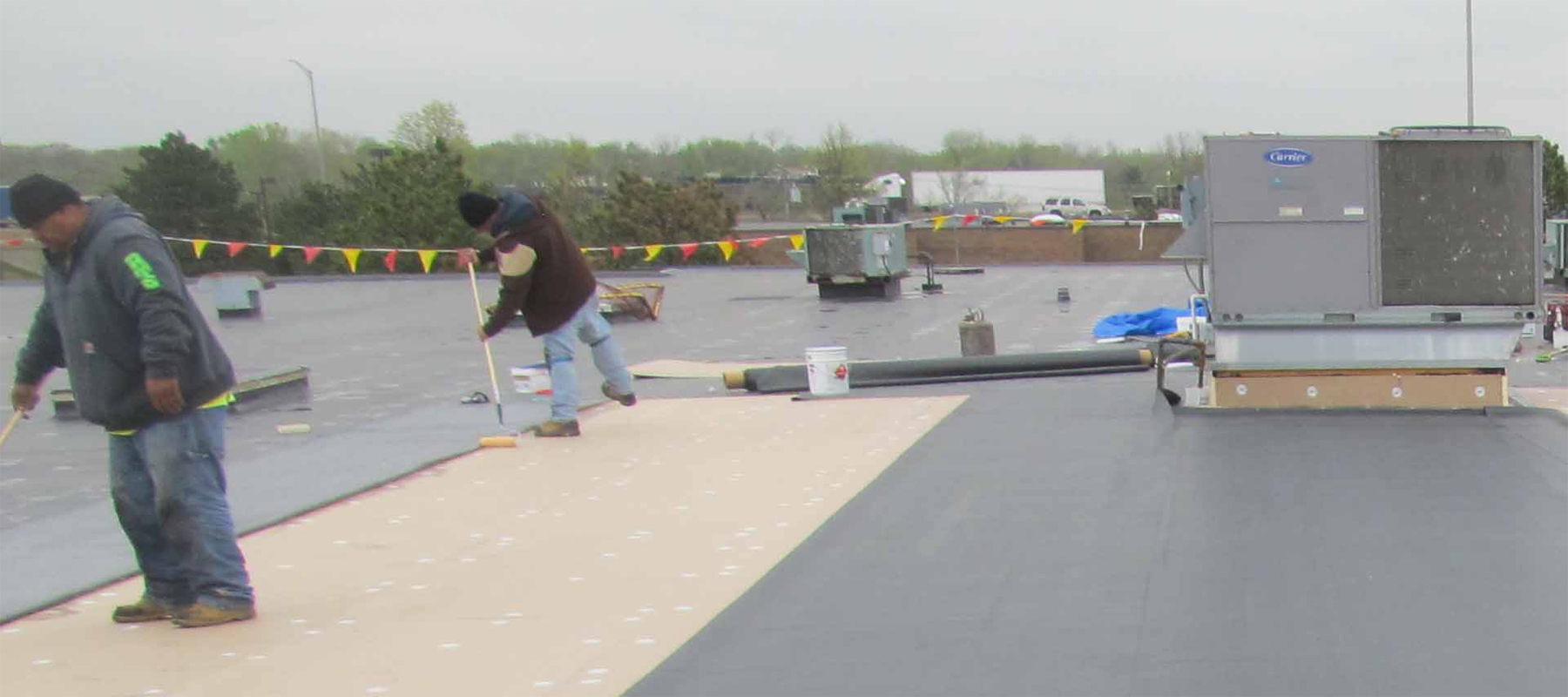 Workers Installing a Commercial EPDM Rubber Roof