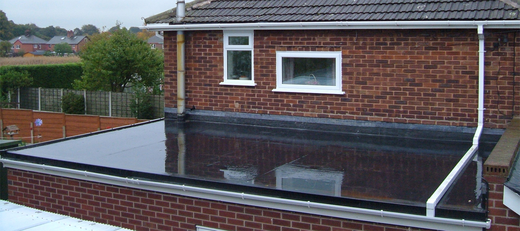 A Rubber Roof on a Brick Building