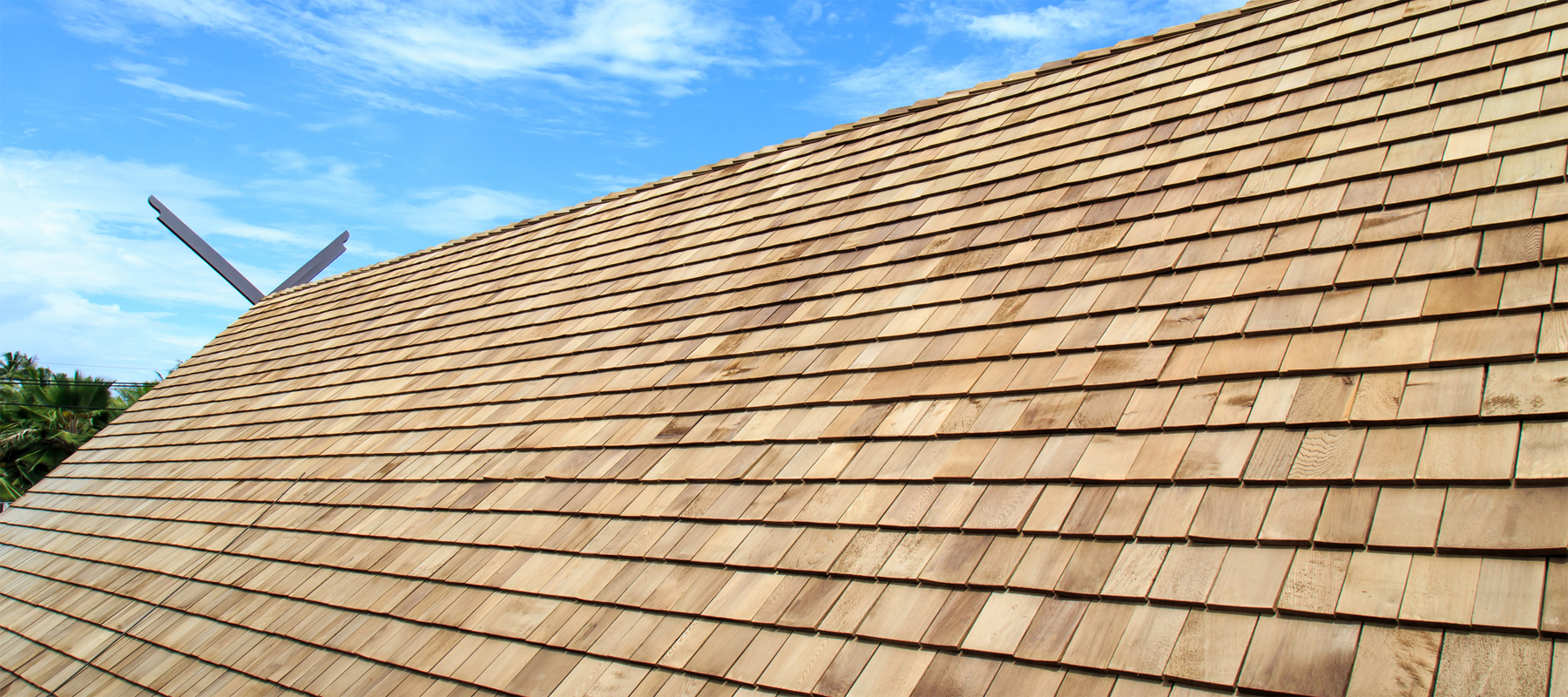 Wood Shake Roof Against Blue Sky