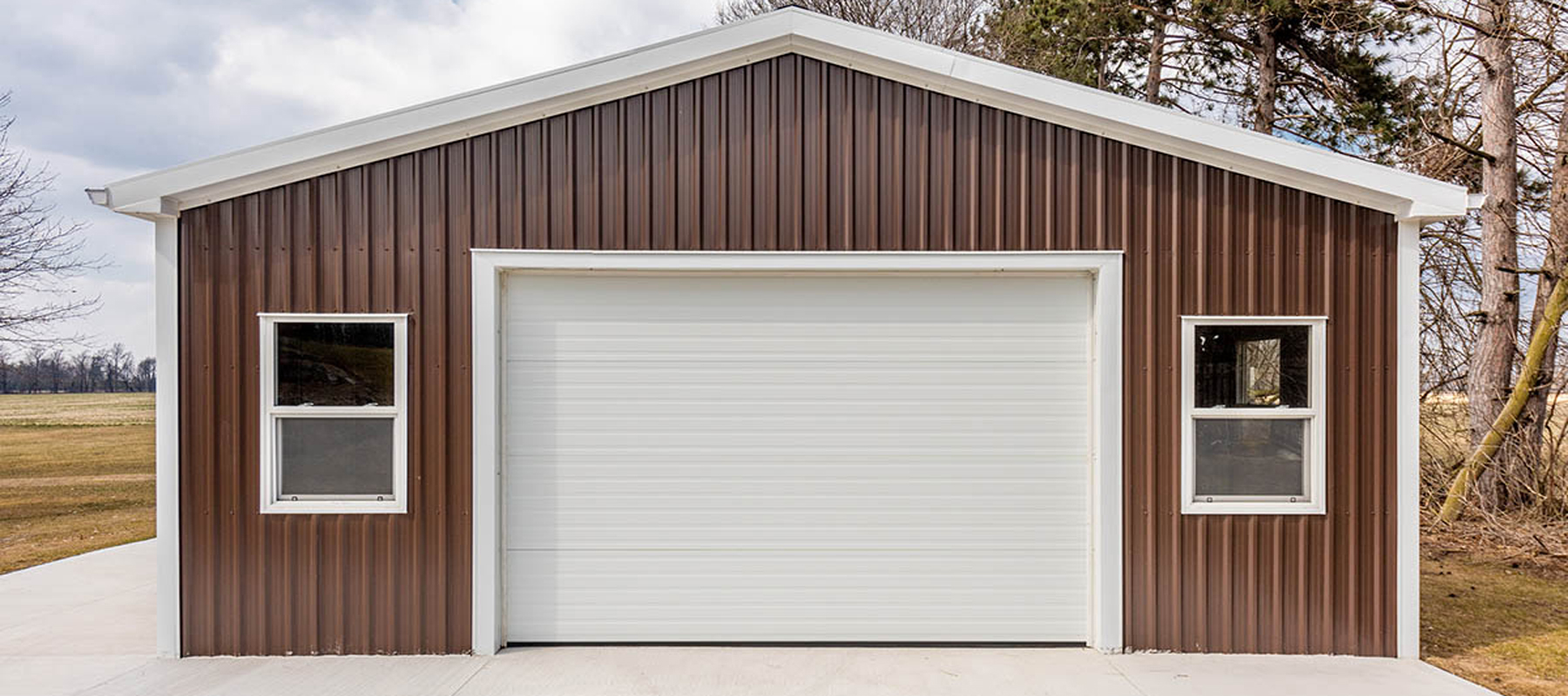 A Maroon Steel Garage Building - Residential