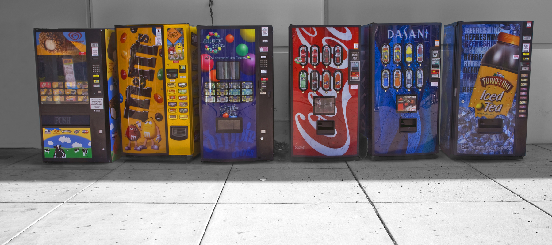 A Row Of Vending Machines Outside